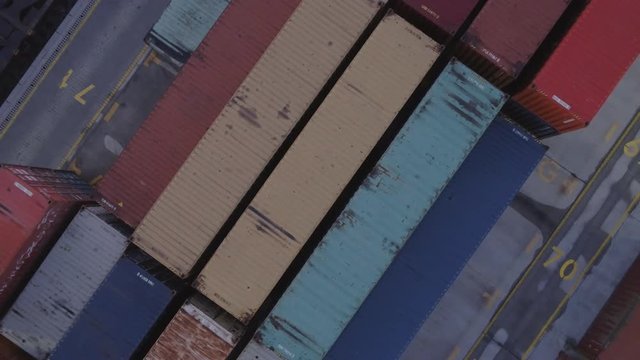 The drone rises above the colorful intermodal containers.