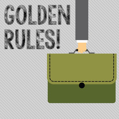 Text sign showing Golden Rules. Business photo showcasing principle should followed to ensure success in general activity Businessman Hand Carrying Colorful Briefcase Portfolio with Stitch Applique