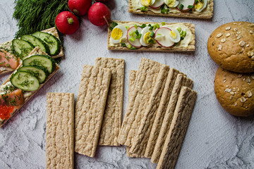 Dietary bread. Substitute for slimming bread. Vegetarian sandwiches. Proper nutrition. Light background. Close-up.