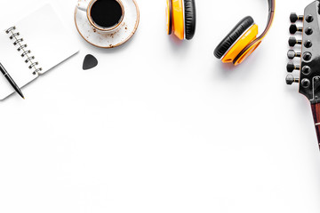 Professional dj instruments with headphones, guitar, notebook and coffee on white background top view mockup