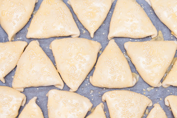 Indian, Asian food raw samsa or samoses. Preparation, cooking.