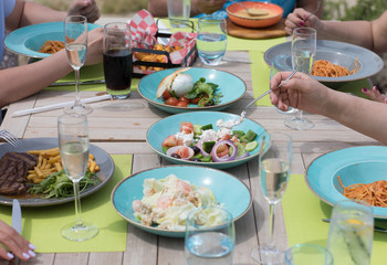 people dine in the restaurant at the outdoor dining table