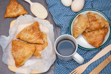 Indian, Asian food delicious samsa or samoses on wooden background. Top view, flat lay.
