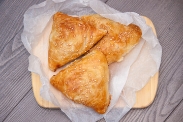 Indian, Asian food delicious samsa or samoses on wooden background. Top view, flat lay.