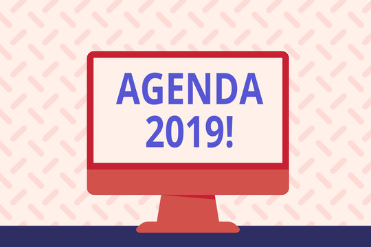 Text sign showing Agenda 2019. Business photo showcasing list of items to be discussed at formal meeting or event Blank Space Desktop Computer Colorful Monitor Screen Freestanding on Table