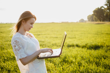 girl with laptop outdoors