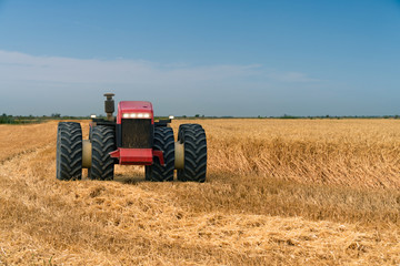 Autonomous tractor working on the field. Smart farming