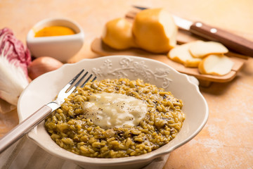 chicory risotto with curcuma and scamorza cheese