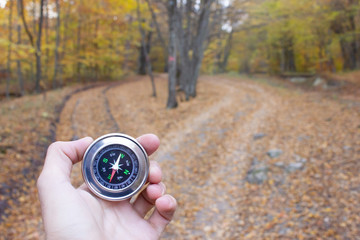 young man hand compass