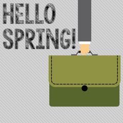 Text sign showing Hello Spring. Business photo showcasing Welcoming season comes after winter Blossoming of plantes Businessman Hand Carrying Colorful Briefcase Portfolio with Stitch Applique