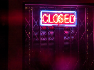 Closed neon sign on the door in Brazil