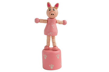 Wooden toy pink pig. Symbol of the year 2019. Isolate