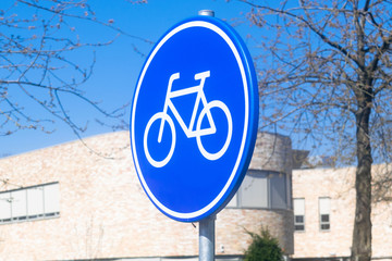 Bicycle lane, blue round sign