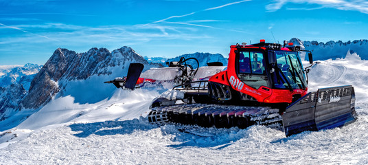 Snow Mobile on top of the rock with blue sky Background in high resolution