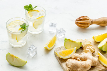 healthy drinks with apple and lemon for summer on white background