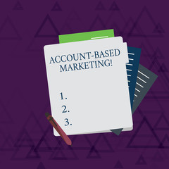 Writing note showing Account Based Marketing. Business concept for strategic approach to business based on accounting Lined Paper Stationery Partly into View from Pastel Folder