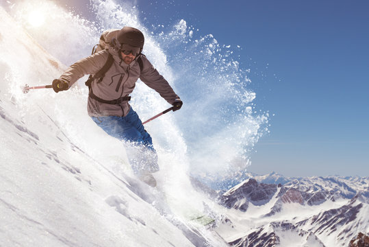 Man skiing on snowcapped mountain