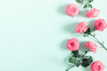 Beautiful flowers composition. Pink rose flowers on pastel blue background. Valentines Day, Easter, Birthday, Mother's day. Flat lay, top view, copy space