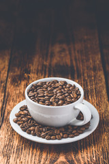 Cup full of roasted coffee beans
