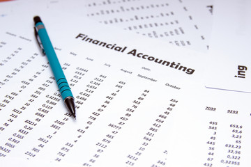 Financial accounting, Image a plurality of numbers on paper. Financial schedules.