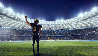 Fototapeta na wymiar American football player in professional sport arena.