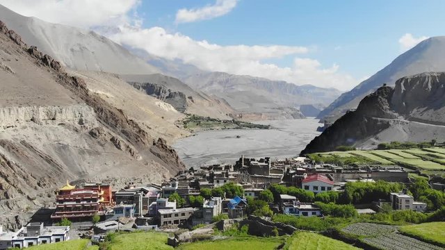 Aerial view of Kagbeni and the mountain valley in the Himalayas. Old houses and agricultural fields. Upper Mustang. Nepal.