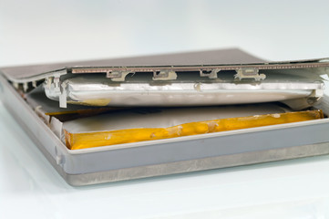 Lithium-ion battery from laptop, which has expanded.