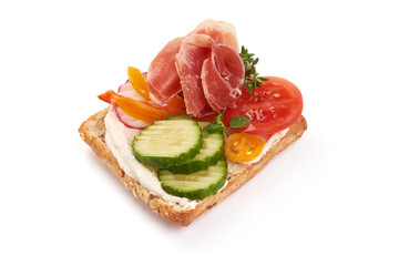 Ham, Jamon or Prosciutto open sandwich, close-up, isolated on white background