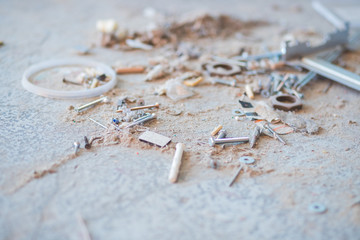 Repair and building a house. Construction tools,  various construction debris, a pile of concrete stones, dust, rubble, fragments of walls of buildings, metal inserts. floor of the destroyed building
