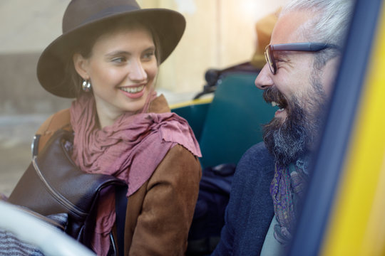 Smiling couple sitting in car