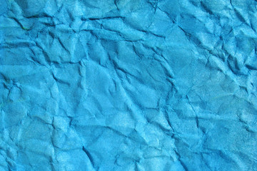 blue color crinkled paper as background