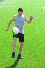 Smiling young adult getting ready for his football match