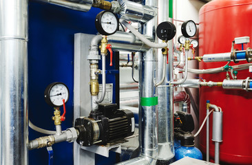 Water treatment pump and pipes with installed pressure gauges for pressure control. Expansion Tank Ventilation System