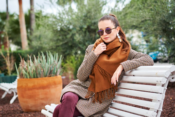 Pretty girl sitting on the bench