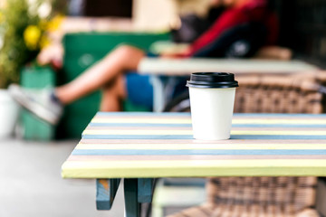 Coffee cup to go in the street cafe