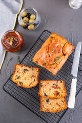 Traditional Italian bread with dried tomatoes and olives. Homemade cakes for lunch and breakfast and ingredients. Free space for text. Copy space