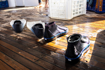 Flippers and special shoes for diving and snorkelling on a boat
