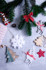 Fototapeta na wymiar Christmas layout with toys, Christmas tree, tinsel and cocoa