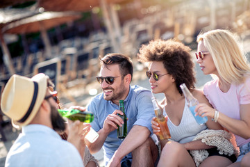 Friends having fun together on the beach