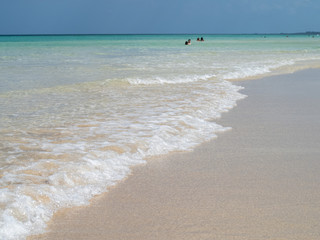 Swimmers in the clear blue Caribbean sea, Cuba