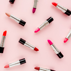 Set of color lipsticks on pink  background. Professional decorative cosmetics, promotional product pomade for advertising. Flat composition beauty, fashion. flat lay, top view