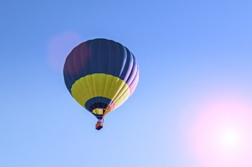 Colorful hot air balloon flying in the blue sky
