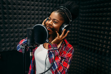 Female performer songs in audio recording studio