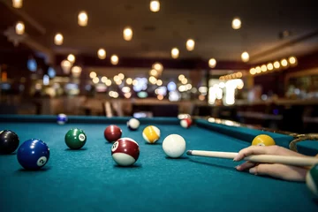 Foto op Plexiglas Selective focus at billiard ball on blue table © RomanR