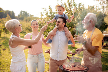 Family having party in garden in summer