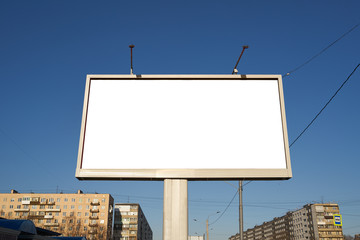 Fototapeta premium 3x6 big billboard standing in the city against the sky during the daytime, with a white advertising space mockup