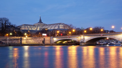 Paris, France - February 16, 2019: Grand Palais and Alexander 3 bridge in Paris at blue hour - obrazy, fototapety, plakaty