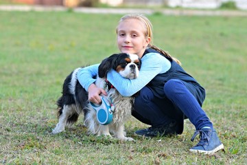 happy child girl with her dog
