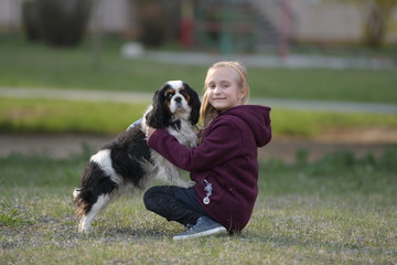 happy child girl with her dog
