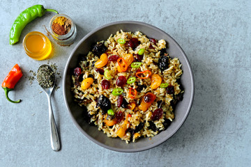 Spicy biryani rice. Vegan rice with dried fruits, spices and chili pepper. Middle Eastern cuisine.